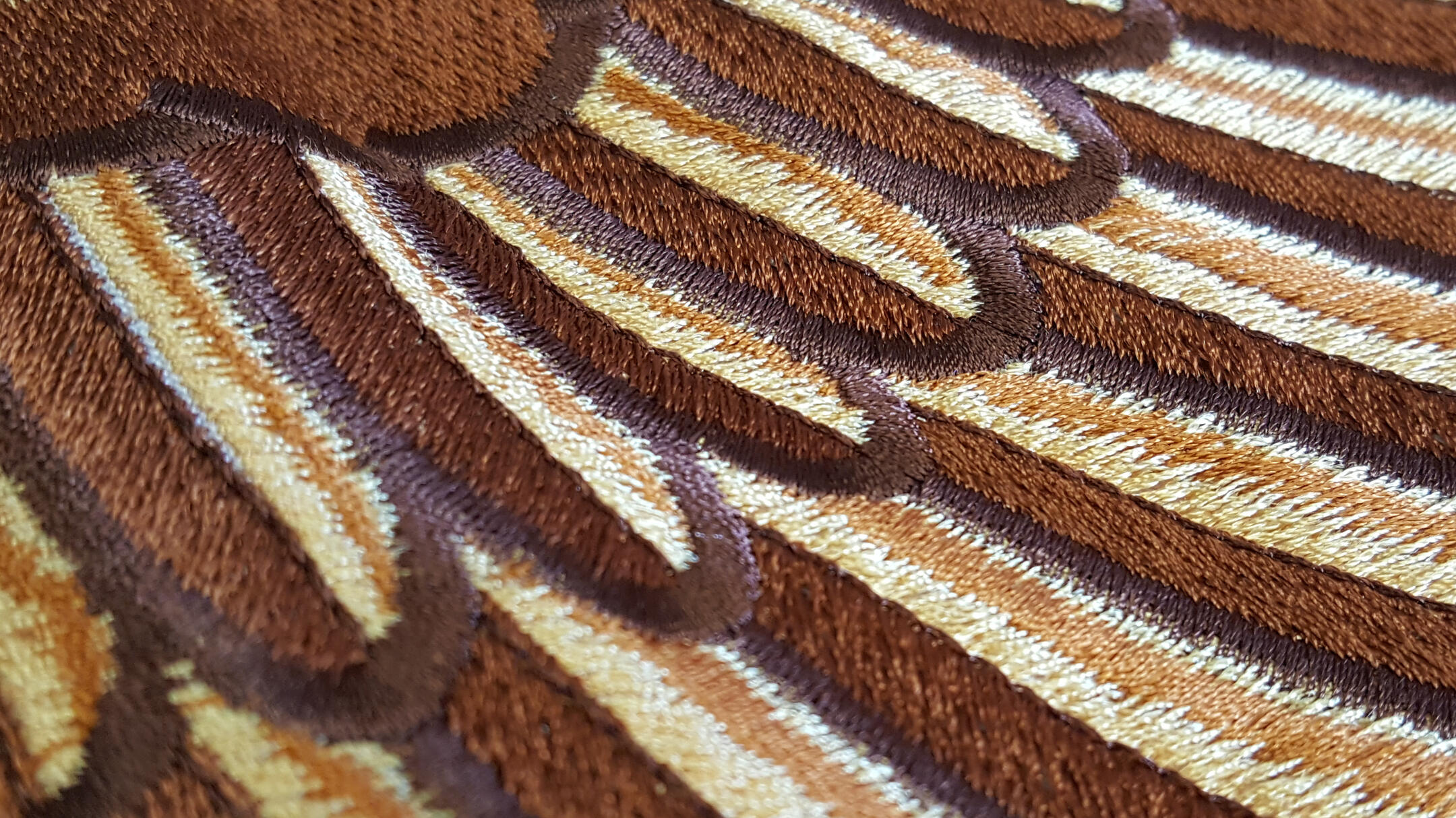 Embroidery machines stitching apparel